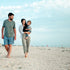 The P Word our potty training program empowers parents using the Montessori approach. Parents walking across a beach with their toddler.